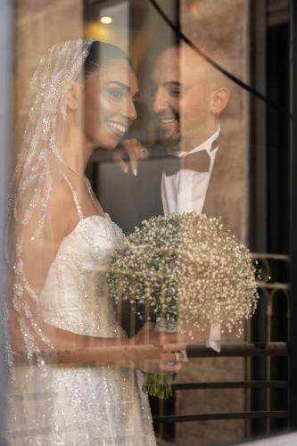 a bride and groom are posing for a picture at New Imperial Hotel in Jerusalem