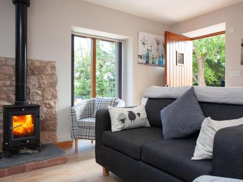 Et opholdsområde på Poppy Cottage - Uk31296