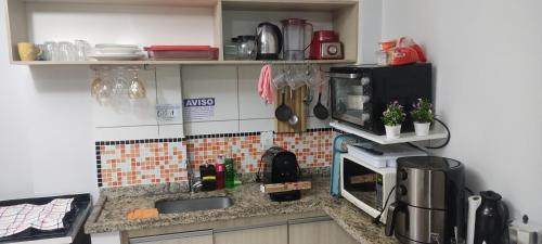 Kuchyň nebo kuchyňský kout v ubytování Golden Dolphin Grand Hotel - Apt 2 quartos - Comporta até 7 hospedes mais uma criança de até 5 anos - com Netflix
