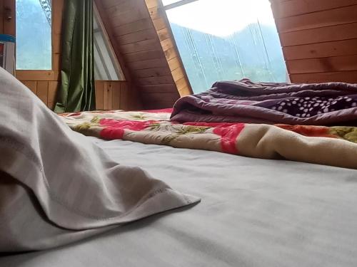 Katil atau katil-katil dalam bilik di Skytouch cottage stargazing