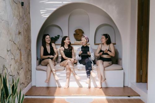 a group of women sitting on a couch at The Bora Villas in Ngaglik