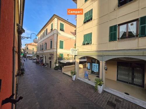 an empty street in a city with buildings at MiTo - By Ligooria in Pietra Ligure
