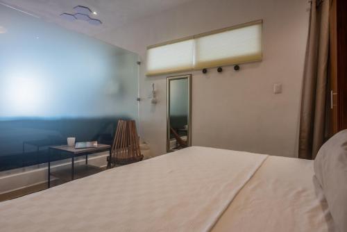 Postel nebo postele na pokoji v ubytování Casa Bene Villas
