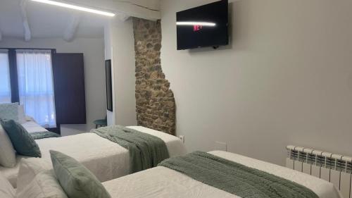 Ένα ή περισσότερα κρεβάτια σε δωμάτιο στο Casa Briz