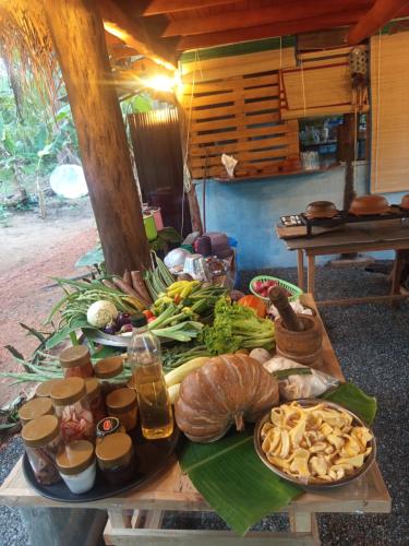 a table with a bunch of food on it at Sigiri Hunter's Eco Tree lodge in Sigiriya