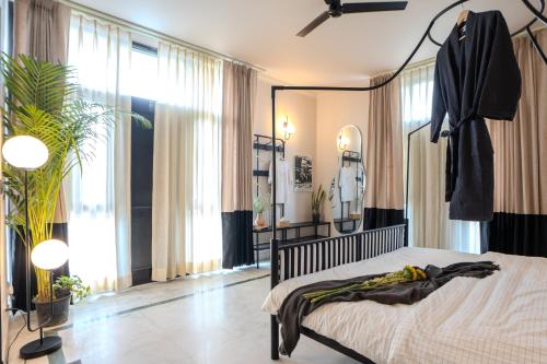 a bedroom with a bed and a mirror at 3000Sqft Ultra Luxury Apartment with Private Cinema In Delhi Poshest Locality Greater Kailash 2 in Jāmb