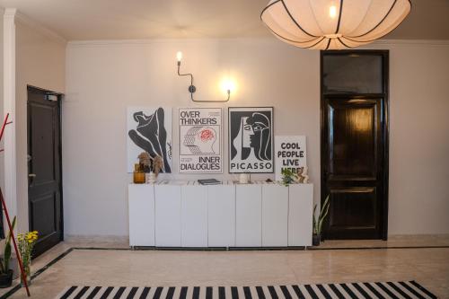 a room with a counter with posters on the wall at 3000Sqft Ultra Luxury Apartment with Private Cinema In Delhi Poshest Locality Greater Kailash 2 in Jāmb