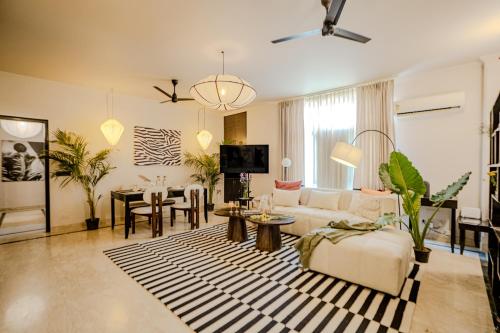 a living room with a couch and a table at 3000Sqft Ultra Luxury Apartment with Private Cinema In Delhi Poshest Locality Greater Kailash 2 in Jāmb