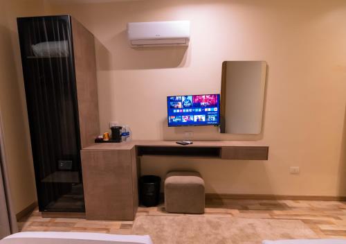 a room with a desk with a computer on it at Elevana Boutique hotel in Cairo