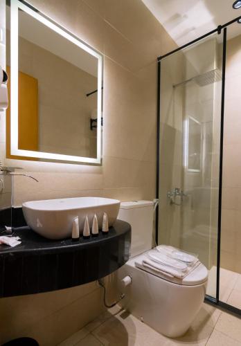 a bathroom with a tub and a sink and a shower at Elevana Boutique hotel in Cairo