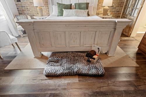 a bedroom with a large bed with a leopard rug at Water Street Retreat Walk To Casinos, Restaurants in Biloxi