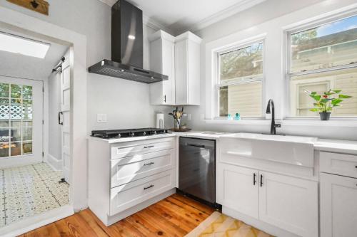 a white kitchen with white cabinets and a sink at SaraCasa - First Floor House 2Br/1.5Bath in St. Augustine