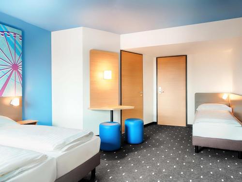 Ein Bett oder Betten in einem Zimmer der Unterkunft B&B Hotel Wien-Meidling