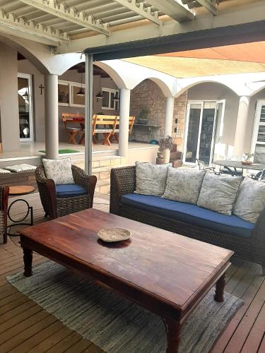 a living room with a couch and a coffee table at Simply The Choice Manor in Panorama