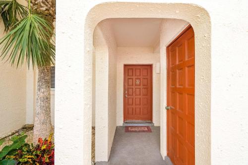an archway leading to a red door in a house at Pier Point South Ocean View Condo B-22 in St. Augustine