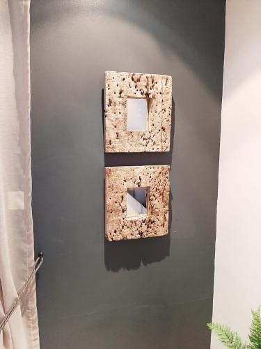 two pieces of art on a wall in a room at Simply The Choice Manor in Panorama