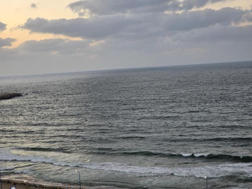 a view of the ocean on a cloudy day at Alex Gate apartment - families only in Alexandria
