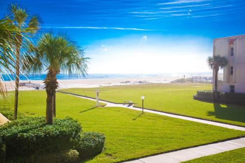 a park with palm trees and the beach at Pier Point South Ocean View Condo B-14 in Saint Augustine Beach