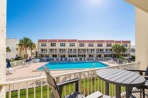 a view of the pool from the balcony of a resort at Pier Point South Ocean View Condo B-18 in St. Augustine