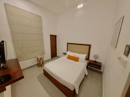 Ένα ή περισσότερα κρεβάτια σε δωμάτιο στο Caroline Villa, Nuwara Eliya