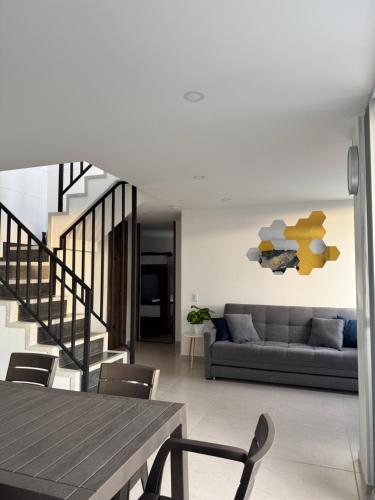 a living room with a couch and a table at Duplex La Mesa Cundinamarca in La Mesa