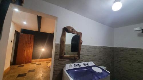 a bathroom with a sink and a mirror on the wall at DesertDewEstate in Nanyuki