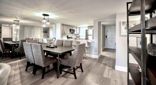 a kitchen and dining room with a table and chairs at Pier Point South Ocean View Condo C-34 in Saint Augustine Beach