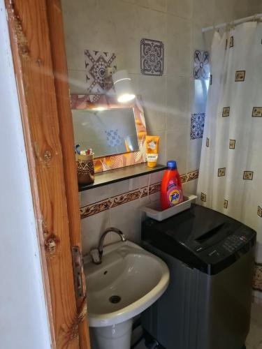 a small bathroom with a sink and a toilet at Beat Mousa in Dahab