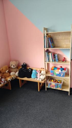a room with two bunk beds with stuffed animals at Alpenhotel Edelweiss in Maurach