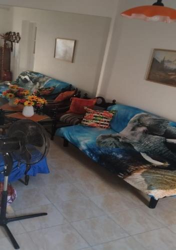 a living room with a couch and a table at Elias Home in Volos