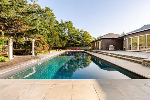 an image of a swimming pool in a house at West Hamptons Zen retreat in Westhampton
