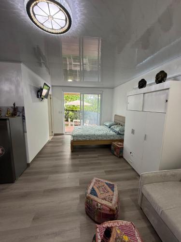 a living room with a bed and a couch at Casa taj beach house in La Loma