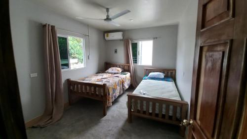 Cama o camas de una habitación en Villas Oasis Verde