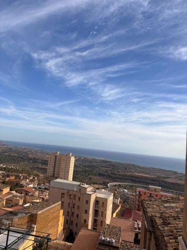 a view of a city with the ocean in the background at Casa Cibella Authentic Charme Apartments in Agrigento