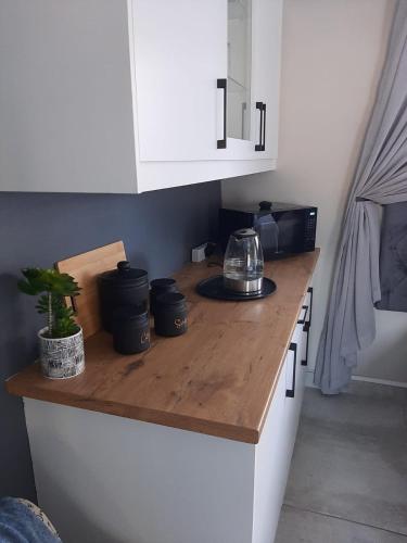 a kitchen with a counter top with a tea kettle on it at Simply The Choice Manor in Panorama