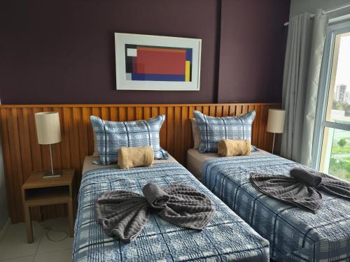 a bedroom with two beds with bows on them at Novo Rio Stay 1605B in Rio de Janeiro