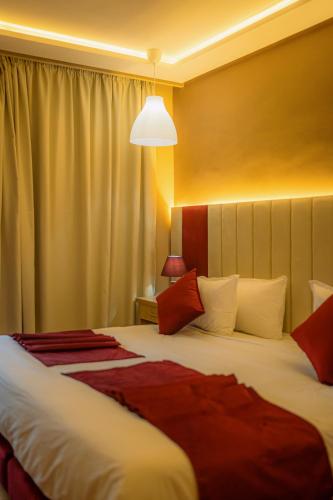 Postel nebo postele na pokoji v ubytování Hôtel Reda Zagora