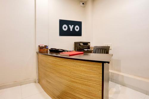 an office with a sign on the wall at Hotel O GREEN PALMS in Nagpur