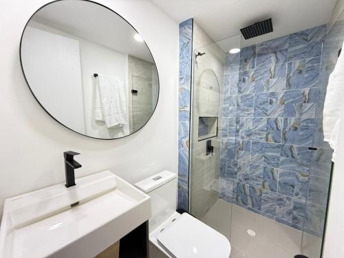 a bathroom with a white sink and a mirror at Beautiful Apartment in Cartagena in Estación El Salto