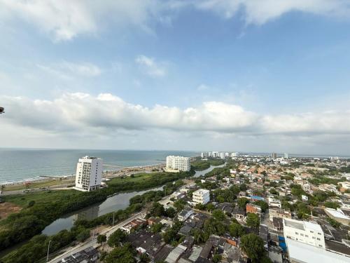 an aerial view of a city and the ocean at Beautiful Apartment in Cartagena in Estación El Salto