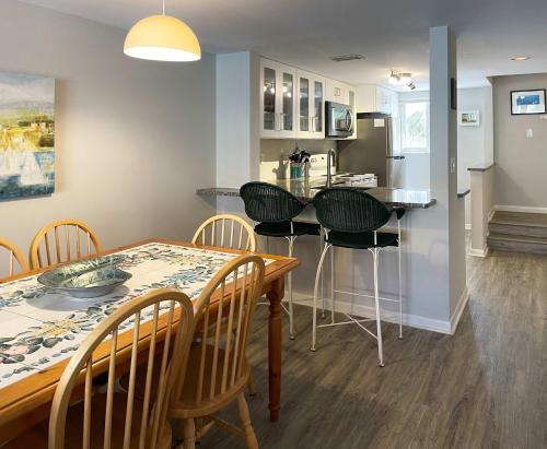 a kitchen and dining room with a table and chairs at Pier Point South Ocean View Townhouse Condo D-49 in Saint Augustine Beach