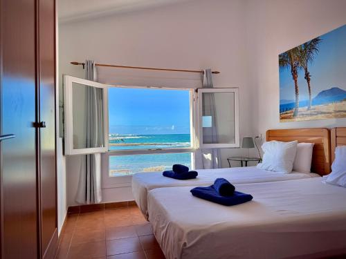 Postel nebo postele na pokoji v ubytování Villa Miranda Los Remos