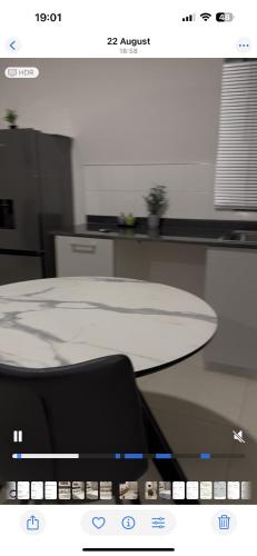 a laptop computer sitting on top of a desk at The Fig Central Apartments in Gaborone