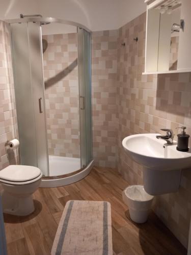 a bathroom with a toilet and a sink and a shower at Bed&Breakfast Bella Vita in Moneglia