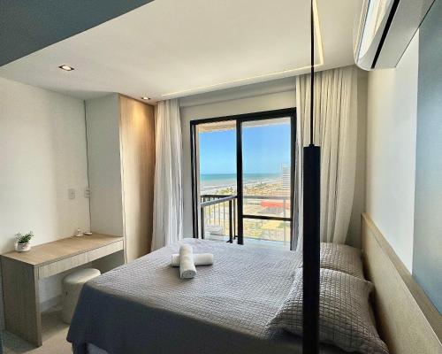 Ένα ή περισσότερα κρεβάτια σε δωμάτιο στο Apartamento Novo e Decorado com Vista Incrível