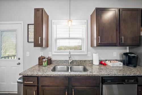 a kitchen with a sink and a counter top at Unit #606 in Clarksville