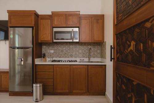 Kuchyň nebo kuchyňský kout v ubytování Apartamentos Santa Delfina