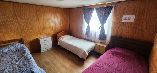 Giường trong phòng chung tại Habitación Privada, Sector Central y Costanera