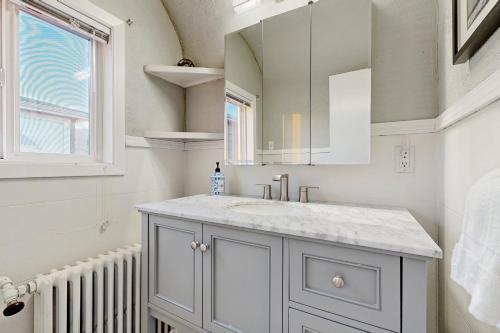 a bathroom with a sink and a mirror at Yorkshore in Seaside