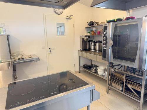 a kitchen with a glass counter top in a room at Aurora Retreat in Selfoss